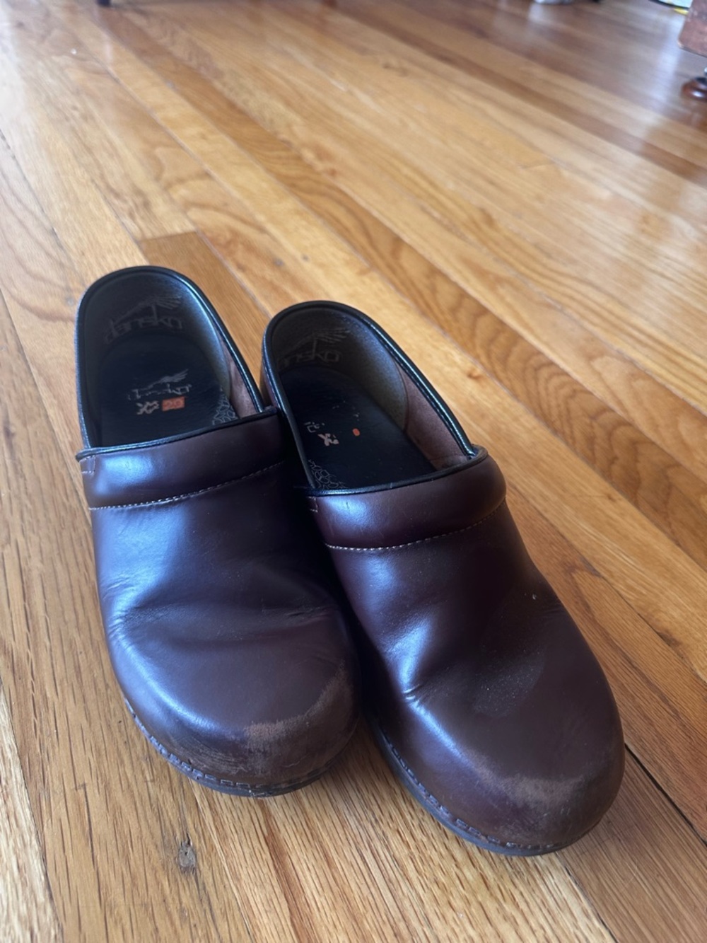 Dansko Woman’s Brown Leather Slip-On Clogs